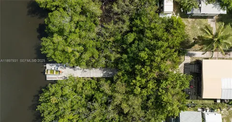 a lake view with tables and chairs