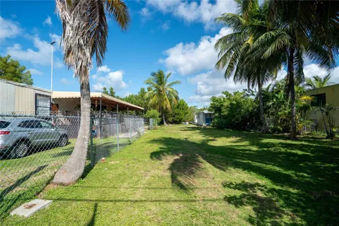 an aerial view of a house with a lake view