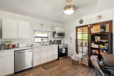 a view of bedroom with furniture and natural light
