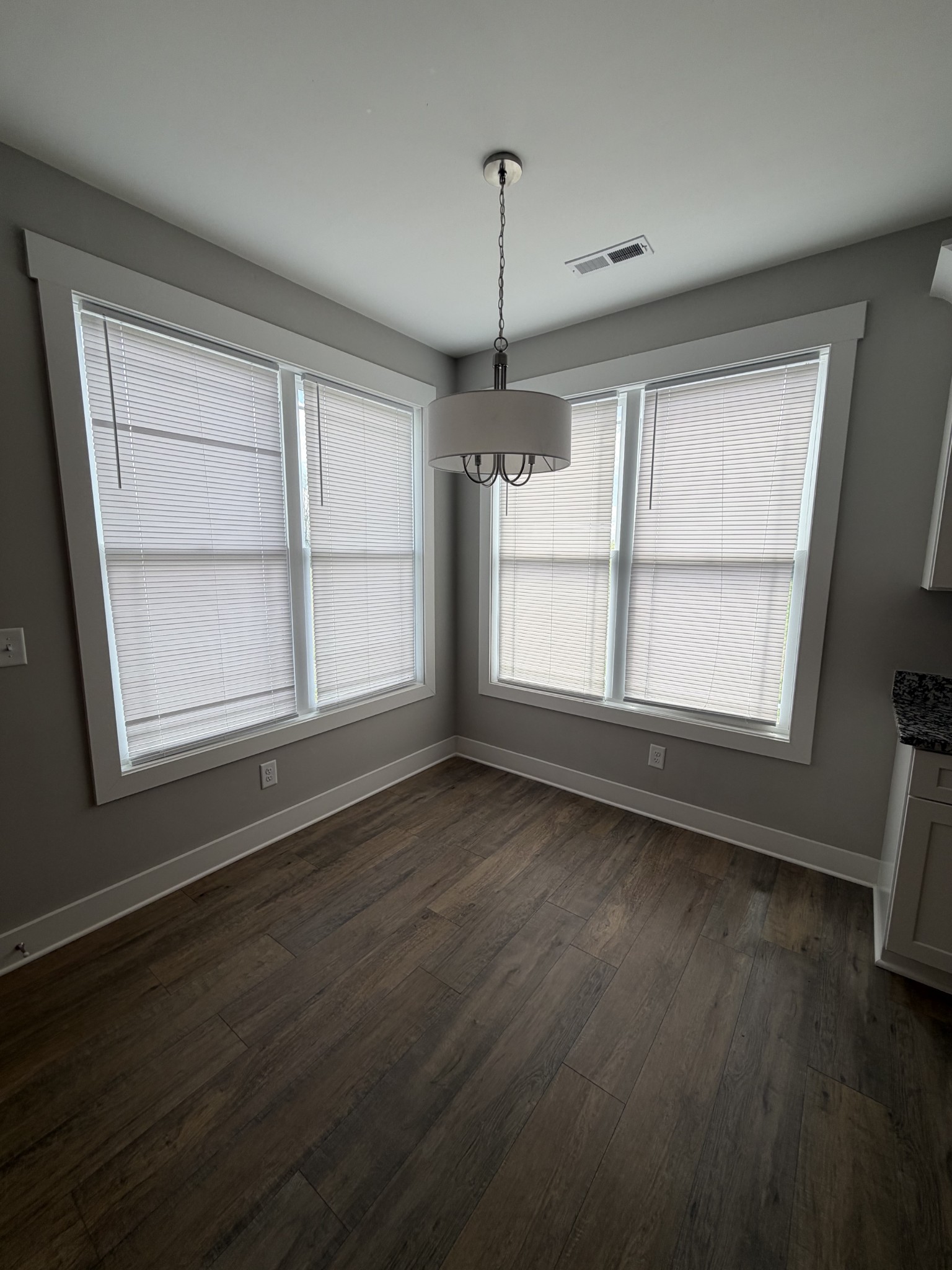 442 Bill Fuson Road McMinnville, TN 37110 - Photo 12 of 29 a view of an empty room with a window and wooden floor