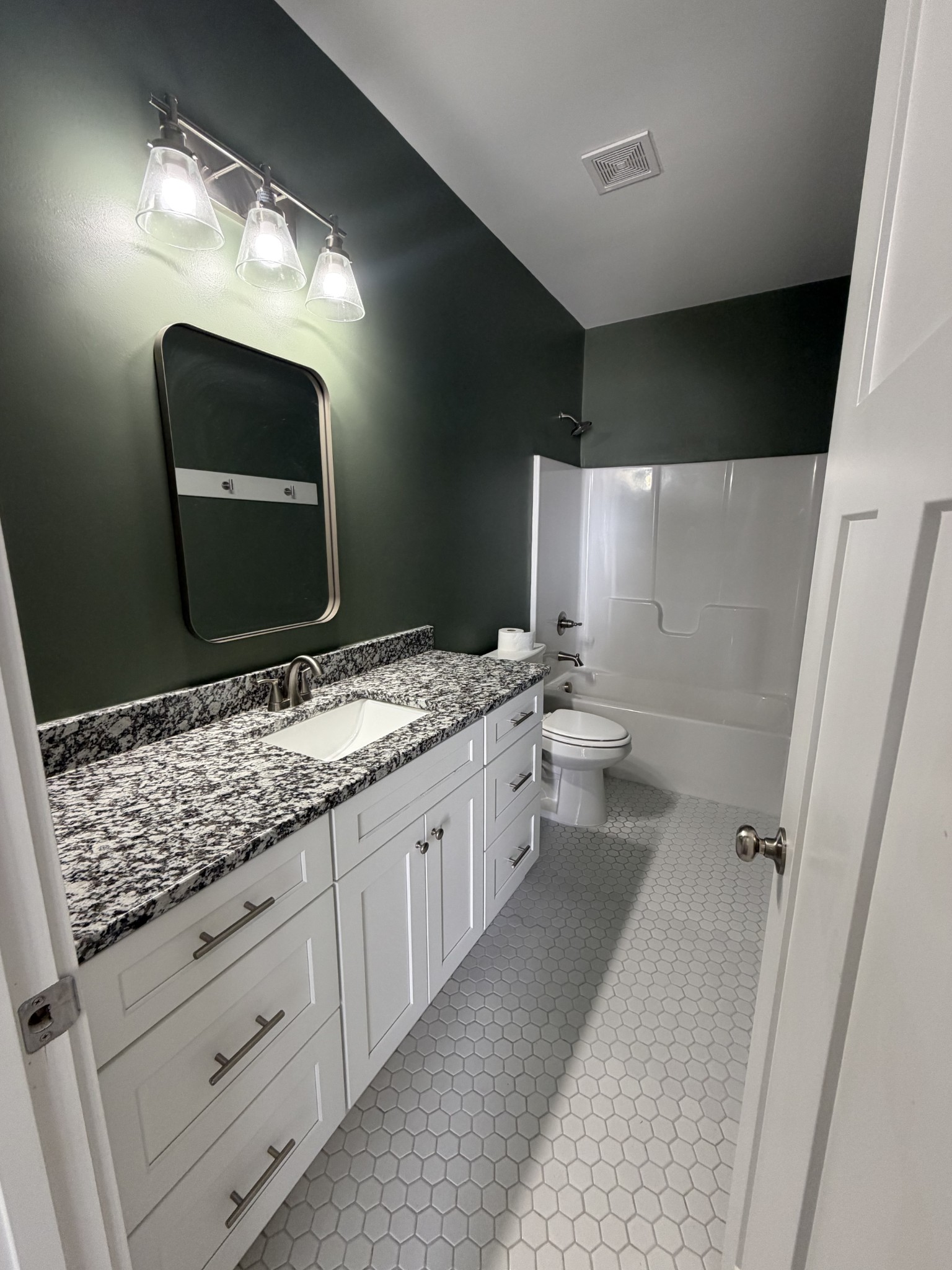 442 Bill Fuson Road McMinnville, TN 37110 - Photo 3 of 29 a bathroom with a double vanity sink and mirror