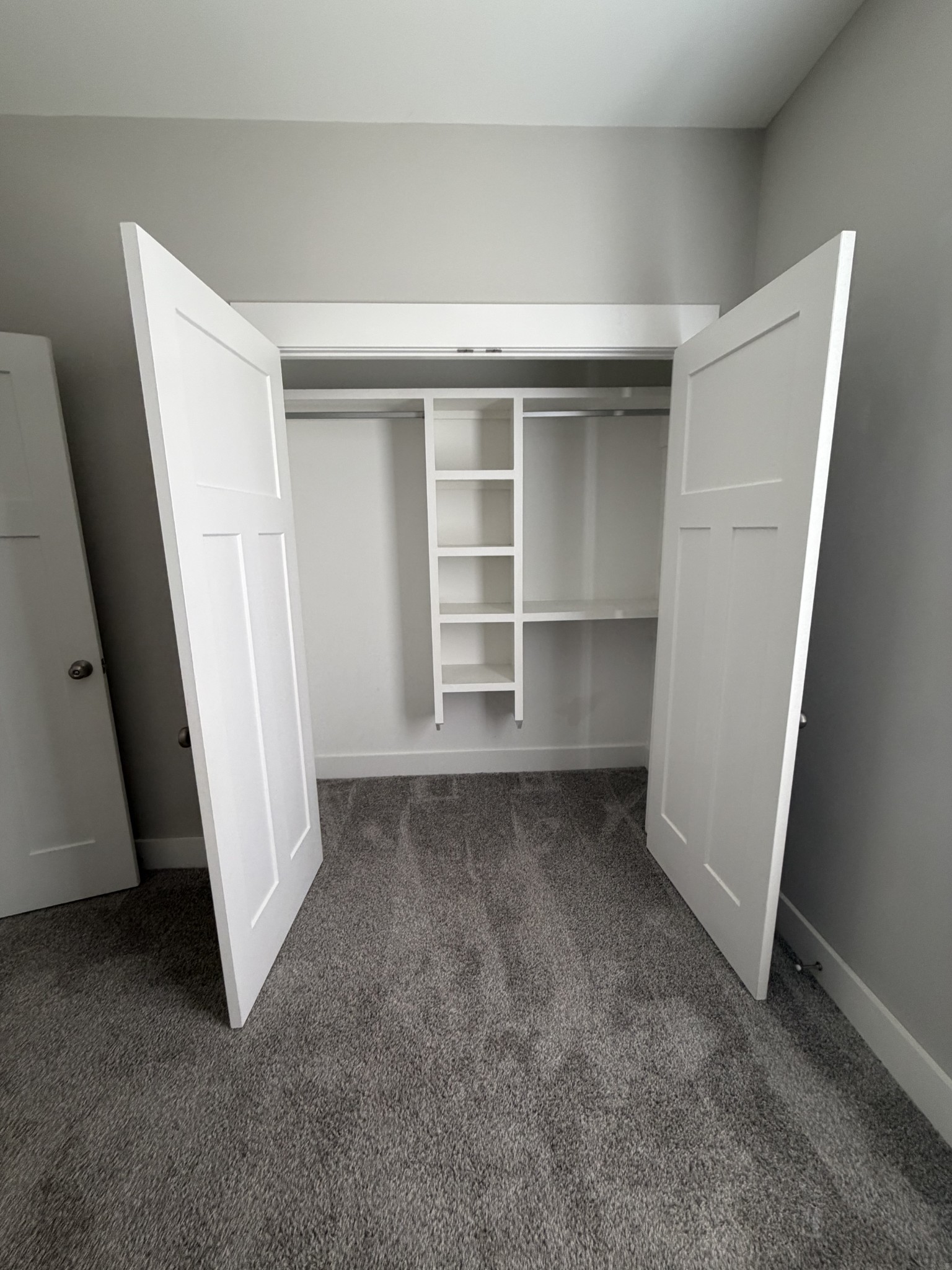 442 Bill Fuson Road McMinnville, TN 37110 - Photo 8 of 29 an empty room with a wooden floor and closet