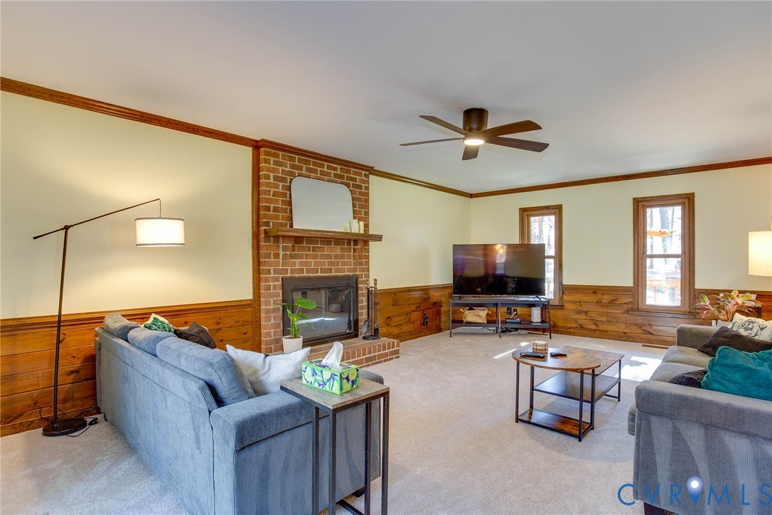 12930 Donegal Drive Chesterfield, VA 23832 - Photo 14 of 43 a living room with furniture and a fireplace