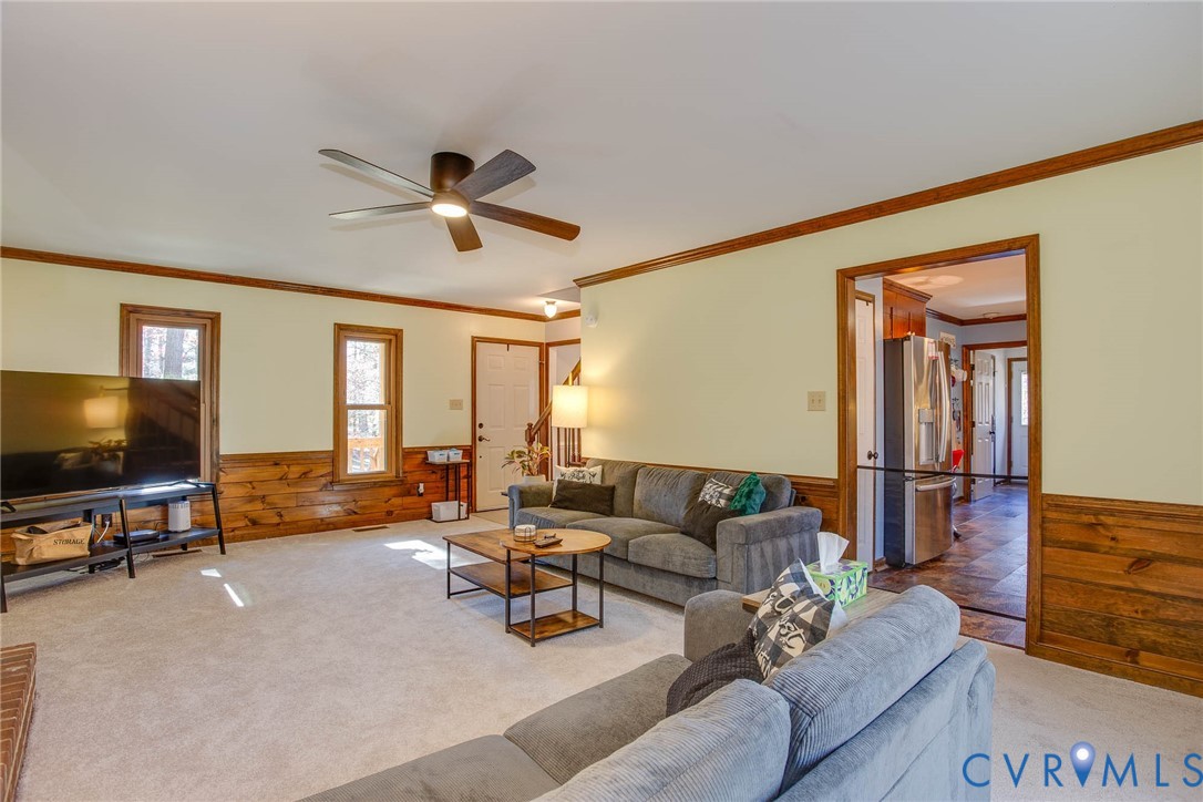12930 Donegal Drive Chesterfield, VA 23832 - Photo 15 of 43 a living room with furniture and a flat screen tv