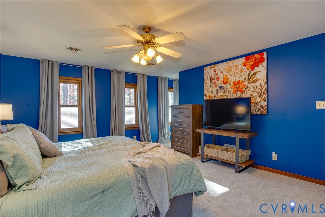 12930 Donegal Drive Chesterfield, VA 23832 - Photo 18 of 43 a bedroom with a bed and a flat screen tv