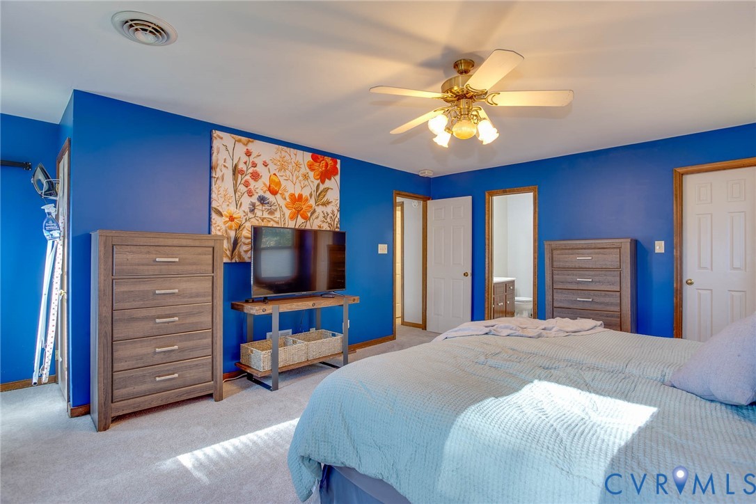 12930 Donegal Drive Chesterfield, VA 23832 - Photo 19 of 43 a bedroom with a bed and a flat screen tv