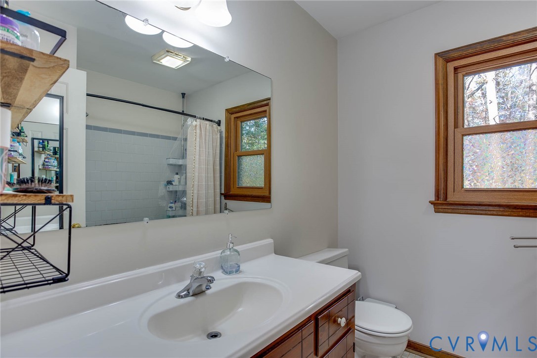 12930 Donegal Drive Chesterfield, VA 23832 - Photo 20 of 43 a bathroom with a sink toilet and shower