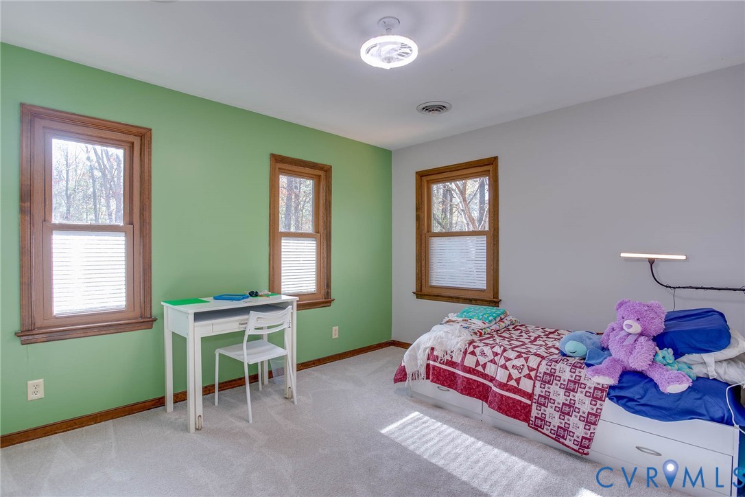 12930 Donegal Drive Chesterfield, VA 23832 - Photo 23 of 43 a bedroom with a bed and windows