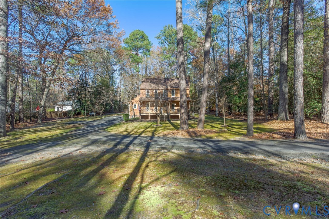 12930 Donegal Drive Chesterfield, VA 23832 - Photo 43 of 43 a view of yard with swimming pool and trees