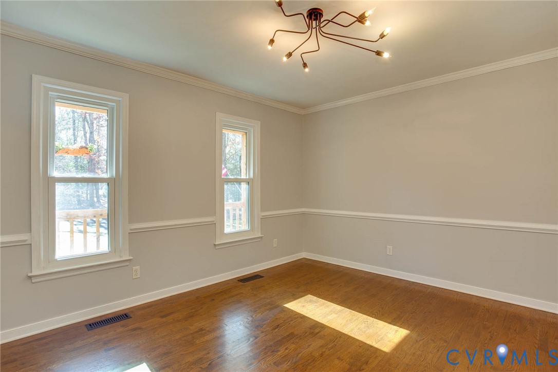 12930 Donegal Drive Chesterfield, VA 23832 - Photo 7 of 43 a view of a room with wooden floor and windows in it