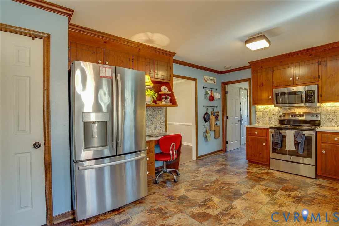 12930 Donegal Drive Chesterfield, VA 23832 - Photo 8 of 43 a kitchen with stainless steel appliances granite countertop a refrigerator and a sink