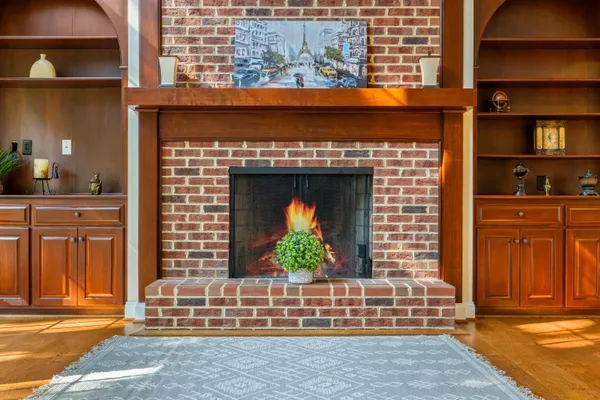 a kitchen with a large window sink and cabinets