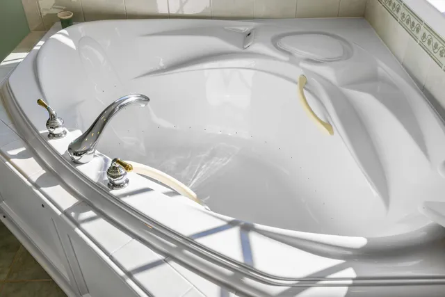 a white toilet sitting next to a bathroom sink