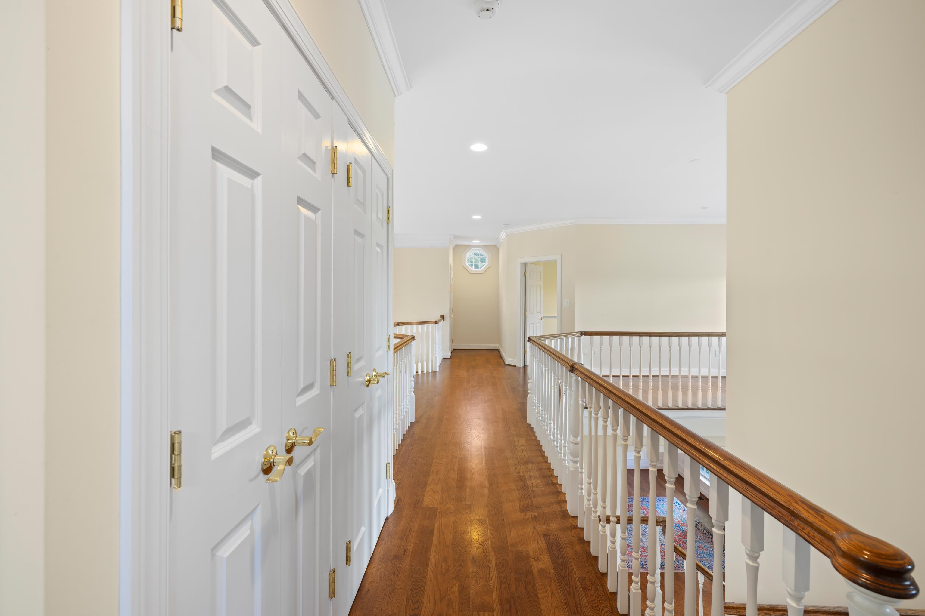 296 Otts Ml Road Raphine, VA 24472 - Photo 42 of 75 a view of a hallway with wooden floor and staircase