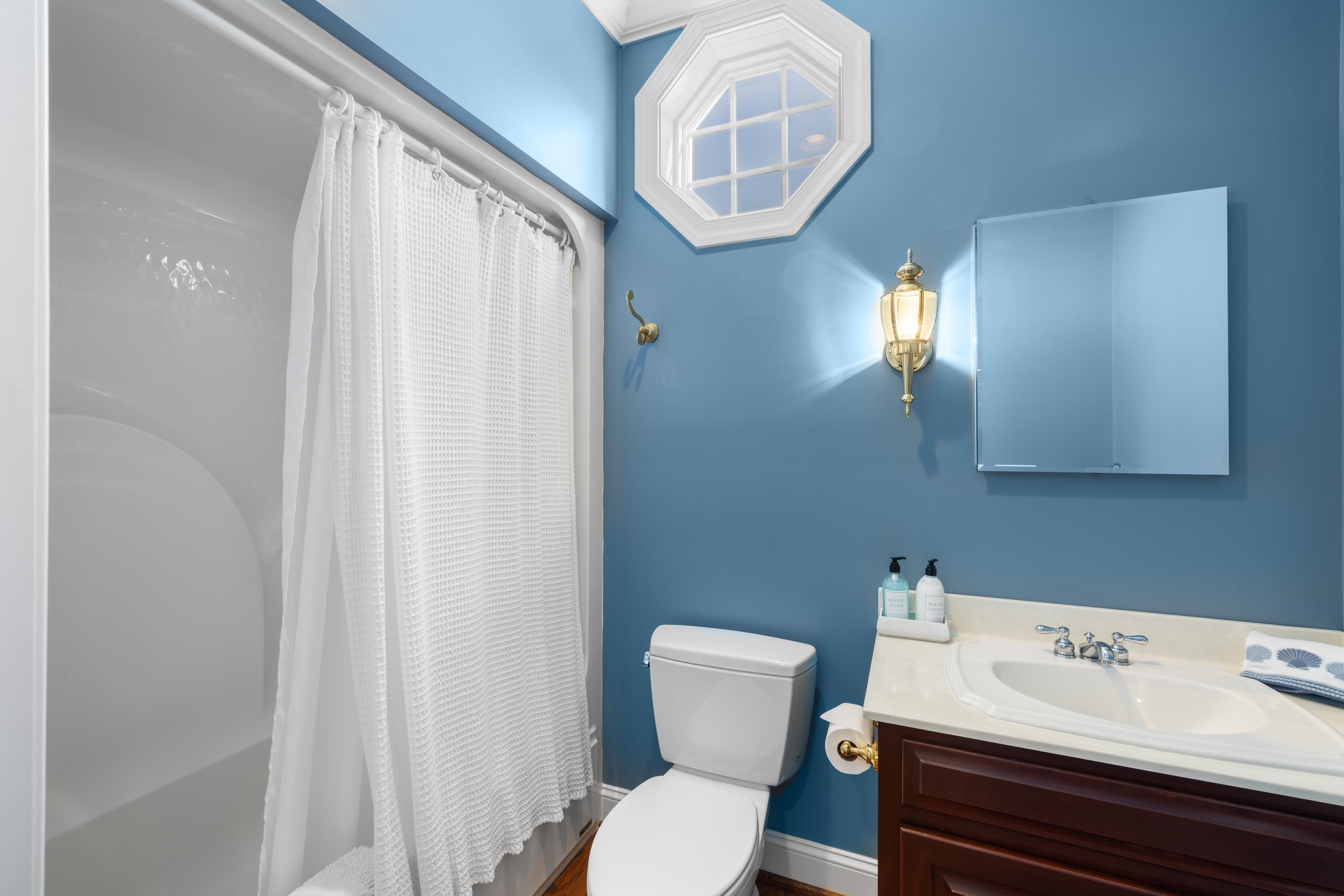 296 Otts Ml Road Raphine, VA 24472 - Photo 51 of 75 a white toilet sitting next to a bathroom sink