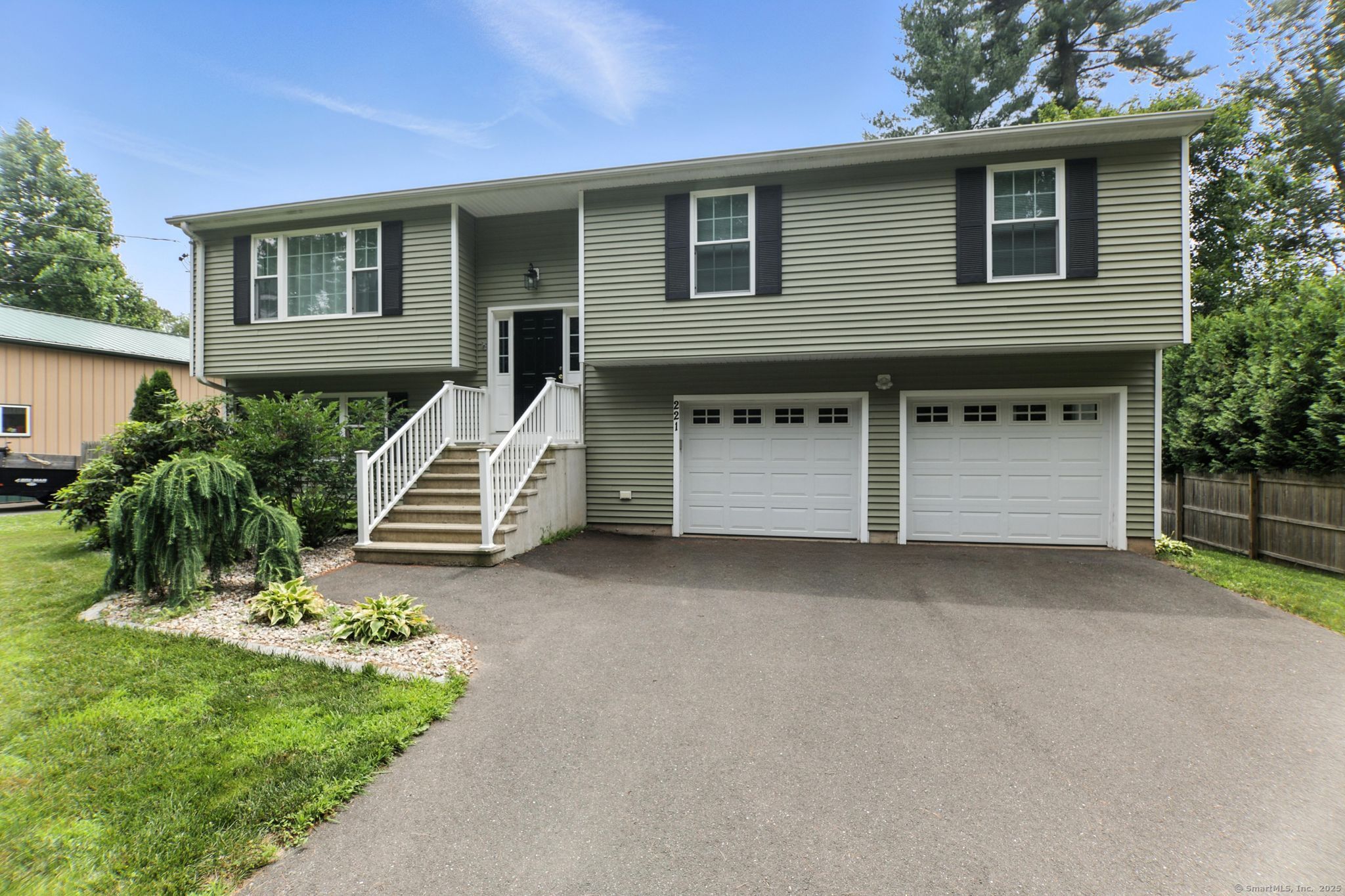 221 Griffin Road Suffield, CT 06093 - Photo 1 of 1 a view of a house with a yard and a garage