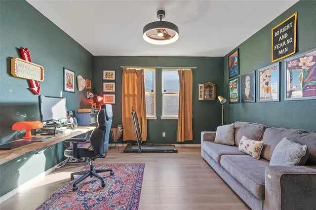 a living room with furniture and a large window