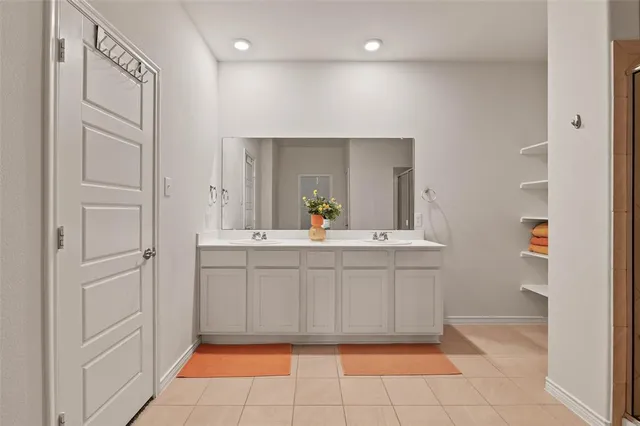a bathroom with a sink a mirror and a vanity