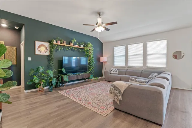 a kitchen with center island table and chairs