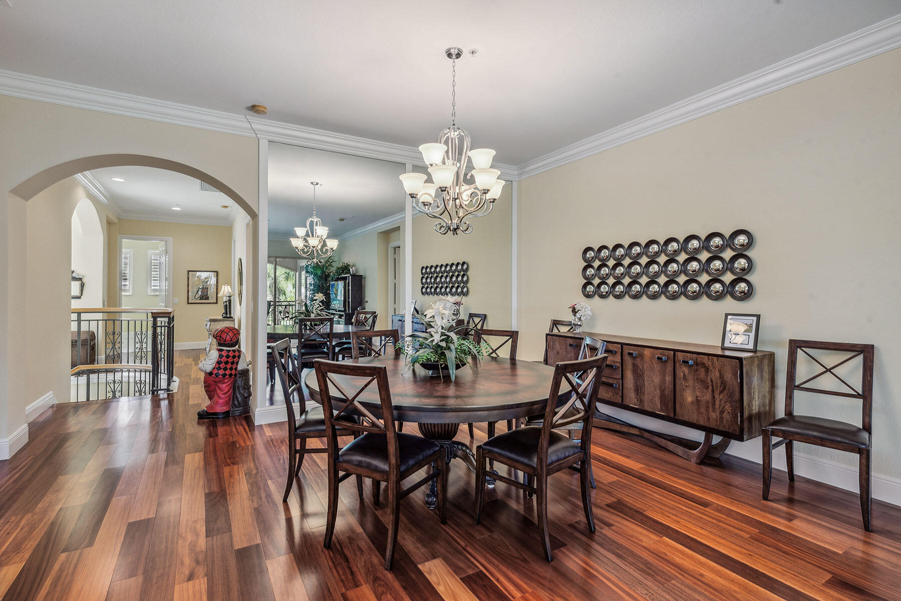3189 Aviamar Circle, Unit 202 Naples, FL 34114 - Photo 5 of 50 a view of a dining room with furniture and wooden floor