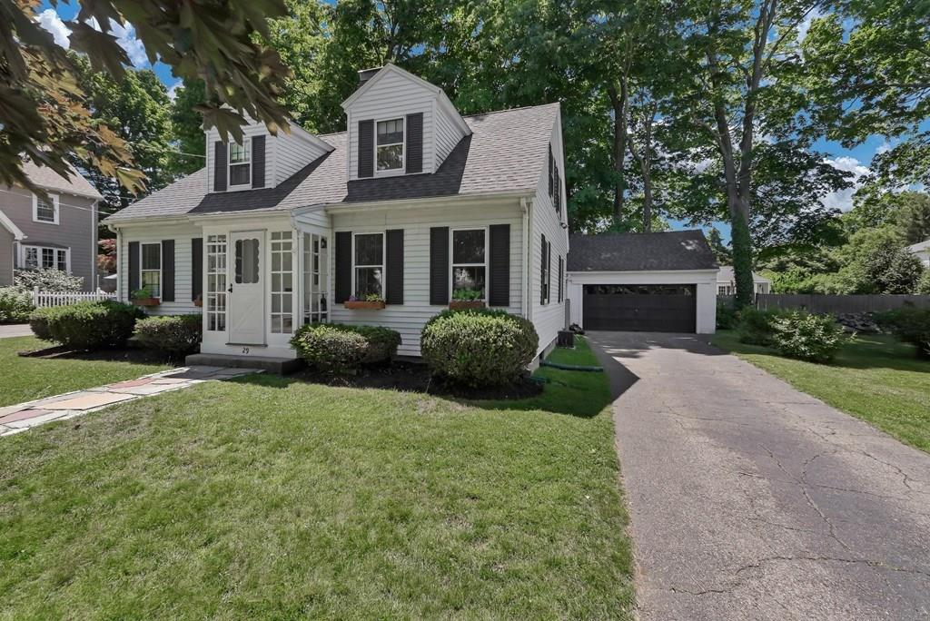 29 Waldeck Road Milton, MA 02186 - Photo 1 of 13 a front view of a house with a yard and garage