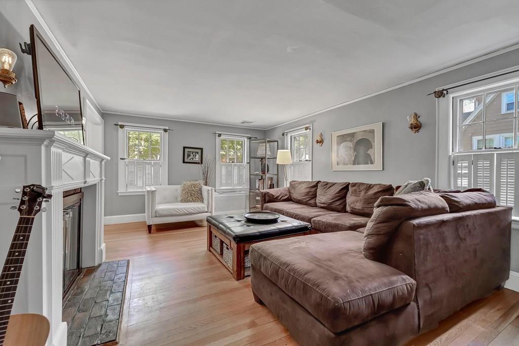 29 Waldeck Road Milton, MA 02186 - Photo 2 of 13 a living room with furniture and a wooden floor