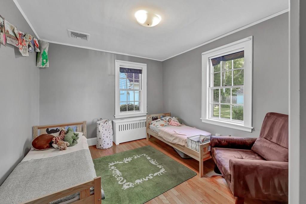 29 Waldeck Road Milton, MA 02186 - Photo 5 of 13 a bedroom with a bed and a window