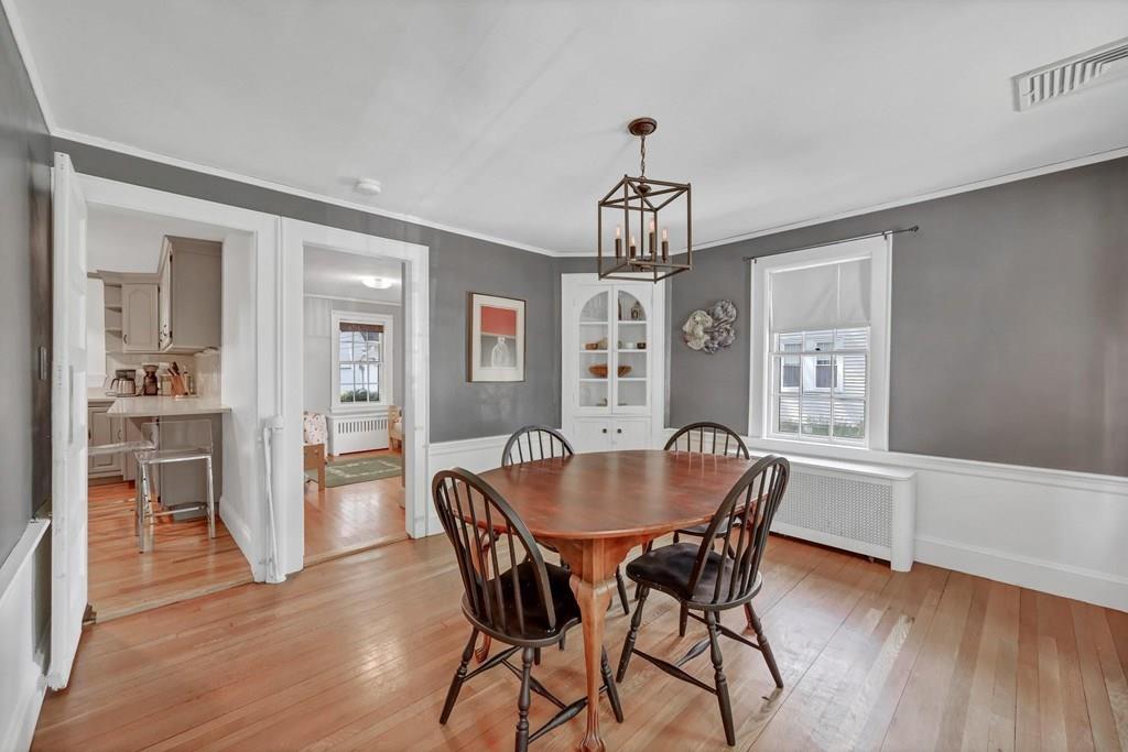 29 Waldeck Road Milton, MA 02186 - Photo 6 of 13 a view of a dining room with furniture window and wooden floor