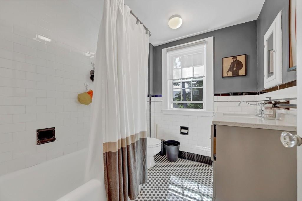 29 Waldeck Road Milton, MA 02186 - Photo 7 of 13 a bathroom with a sink toilet and shower