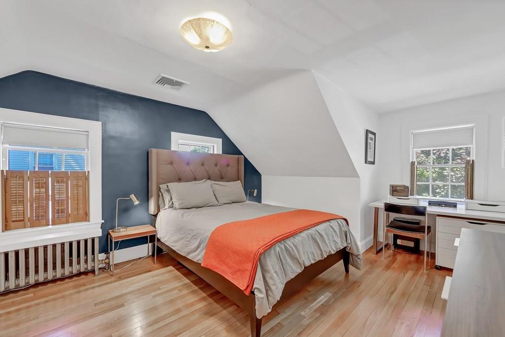 29 Waldeck Road Milton, MA 02186 - Photo 8 of 13 a bedroom with a bed and a table