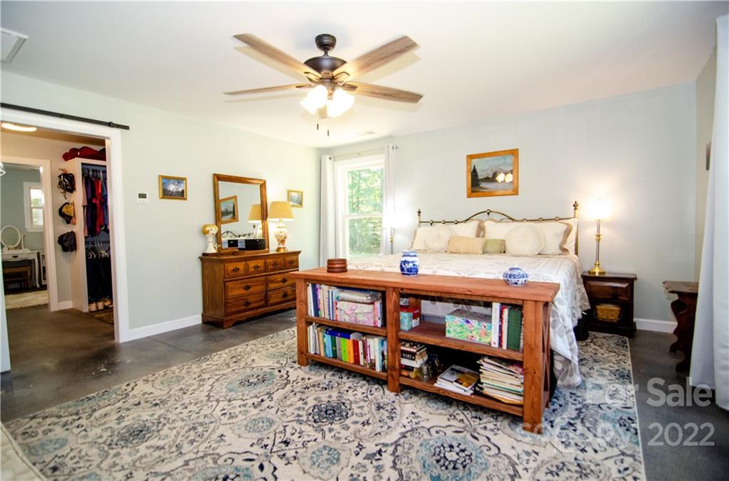 3267 Park Road Ridgeway, SC 29130 - Photo 15 of 40 a bedroom with furniture and a wooden floor
