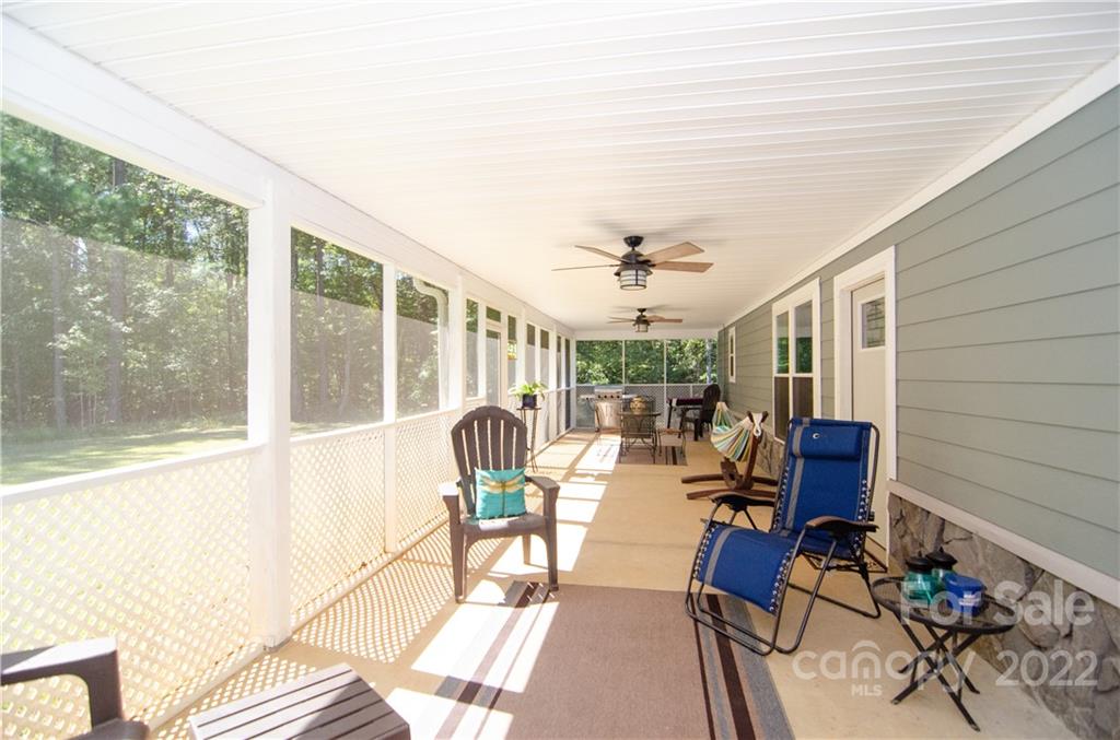 3267 Park Road Ridgeway, SC 29130 - Photo 25 of 40 a view of balcony with chairs and potted plant