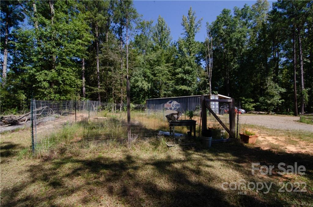 3267 Park Road Ridgeway, SC 29130 - Photo 32 of 40 a view of outdoor space with seating area and trees in the background