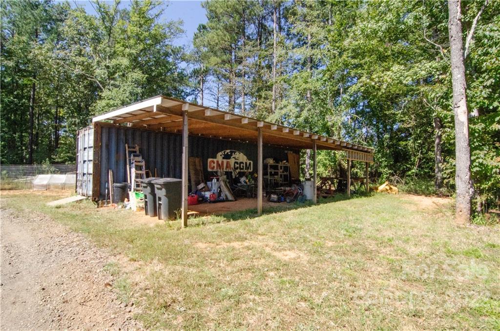 3267 Park Road Ridgeway, SC 29130 - Photo 33 of 40 a view of a chairs and table in the patio and a backyard