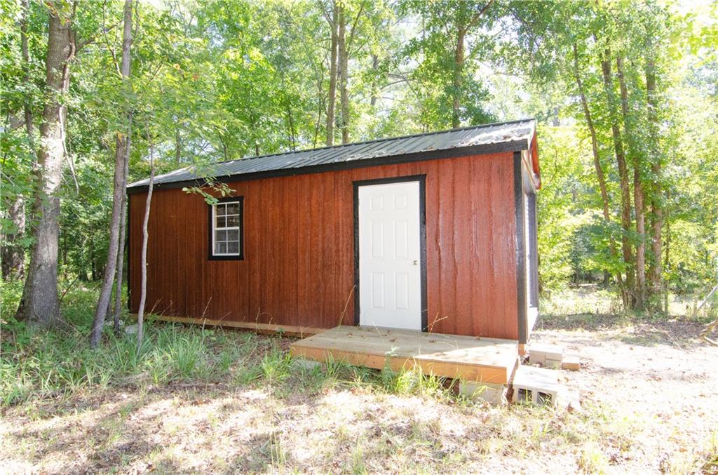 3267 Park Road Ridgeway, SC 29130 - Photo 34 of 40 a backyard of a house with a garden