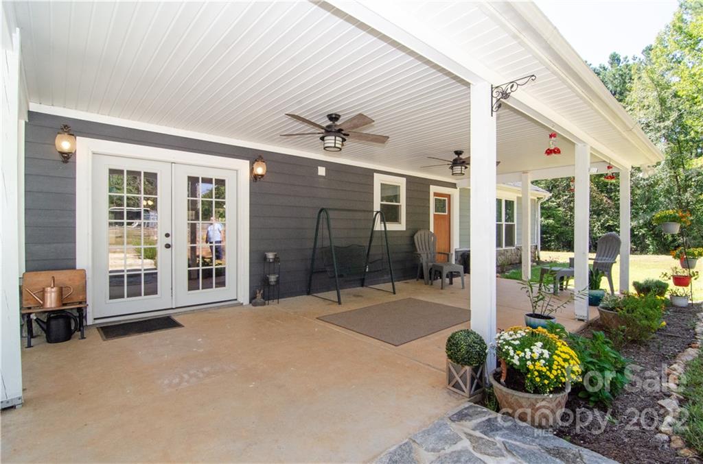 3267 Park Road Ridgeway, SC 29130 - Photo 4 of 40 a outdoor space with lots of potted plants and couches