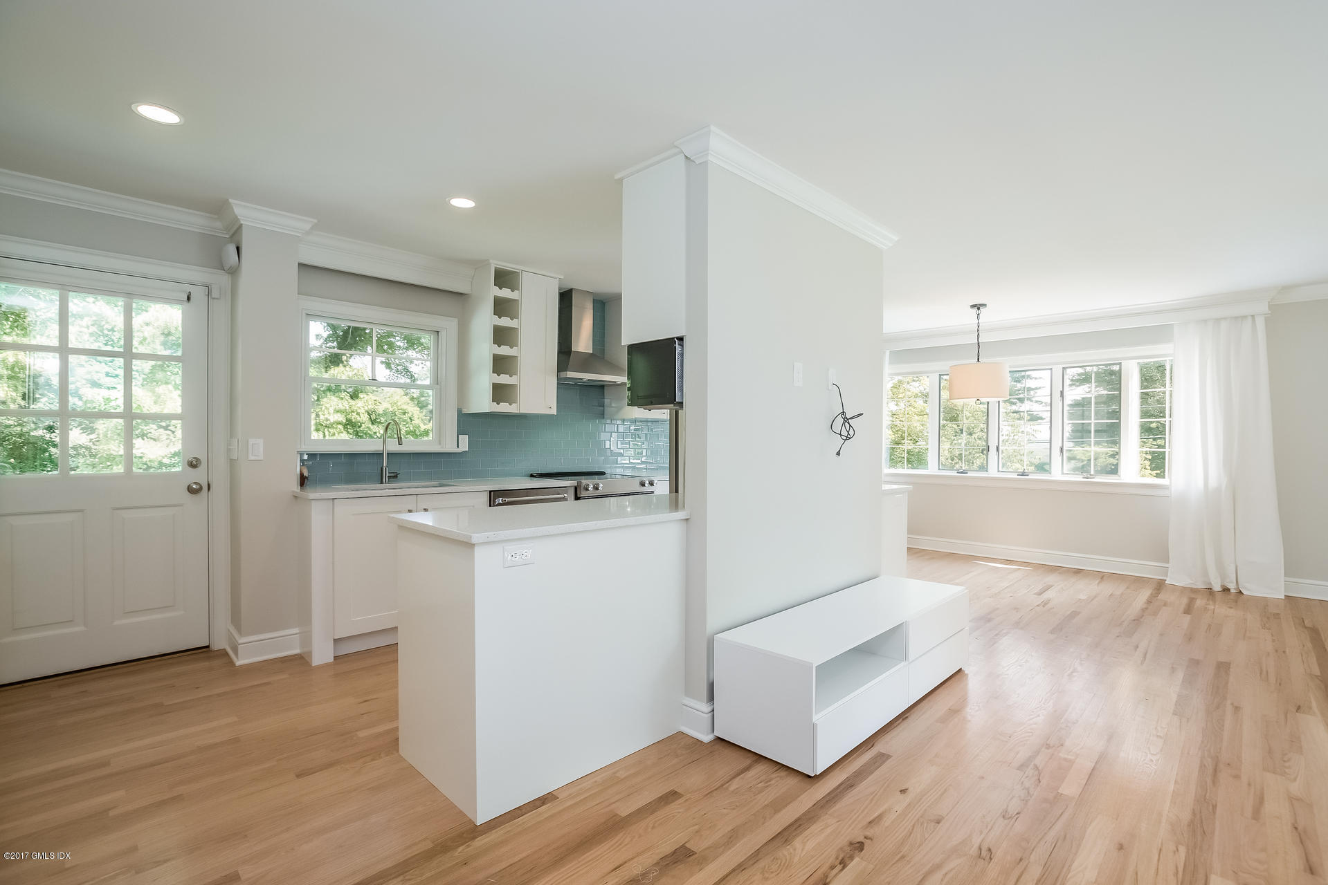 395 Taconic Road Greenwich, CT 06831 - Photo 14 of 36 a kitchen with a refrigerator and wooden floor