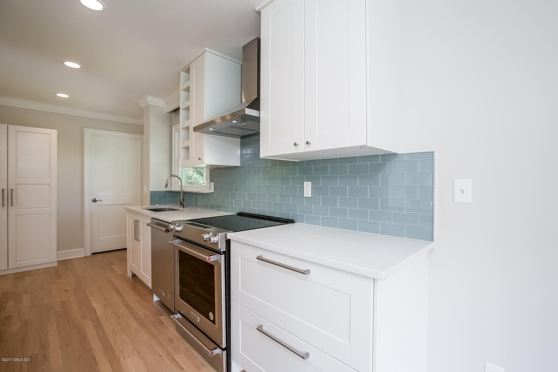 395 Taconic Road Greenwich, CT 06831 - Photo 15 of 36 a kitchen with a stove and a sink