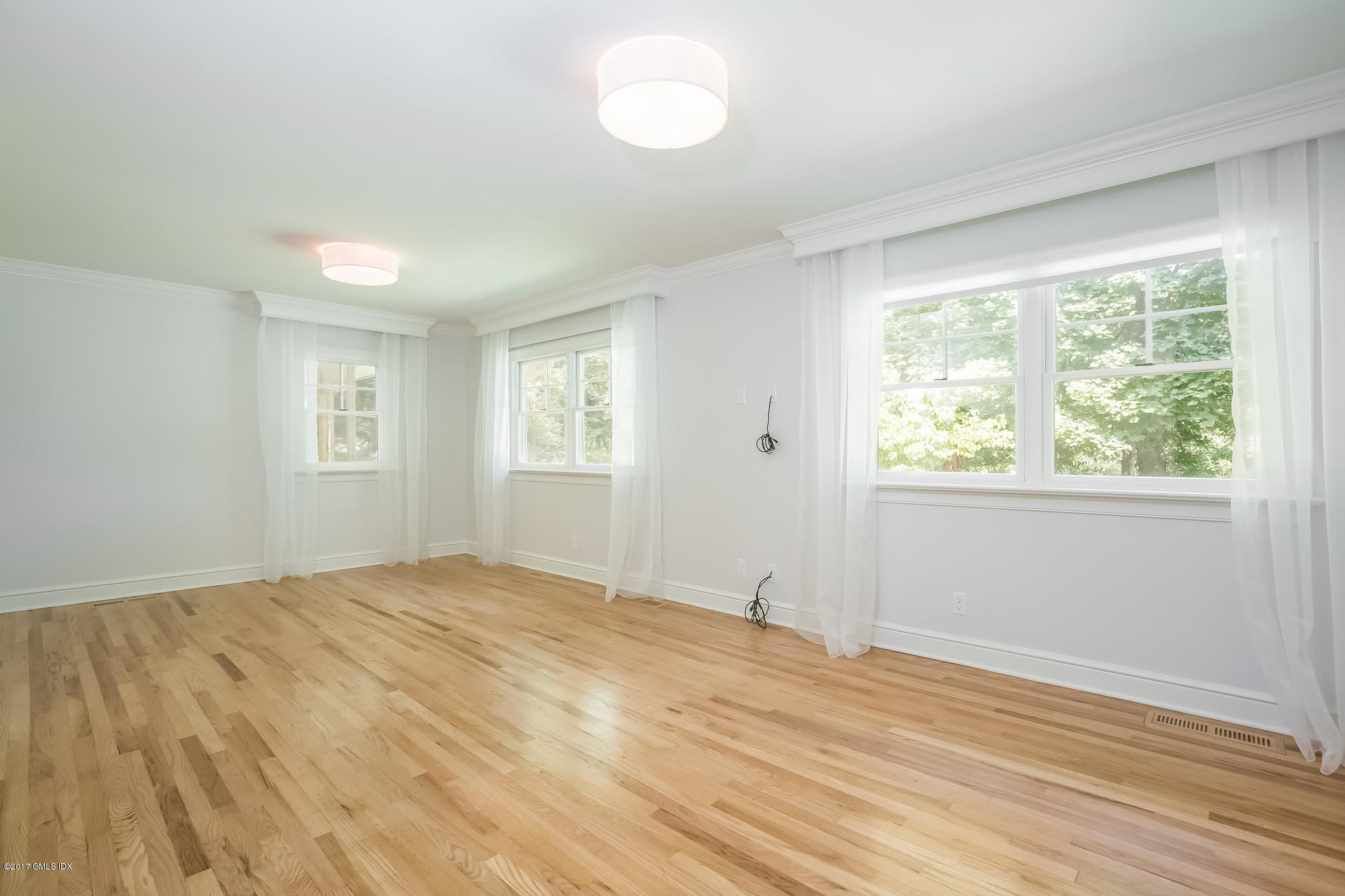 395 Taconic Road Greenwich, CT 06831 - Photo 17 of 36 a view of empty room with wooden floor and fan