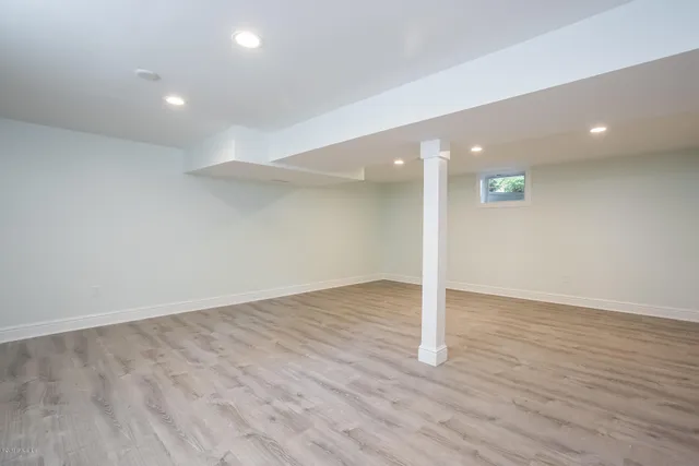 a view of wooden floor and windows in an empty room