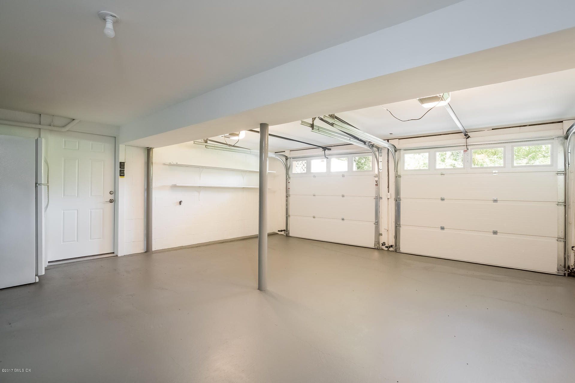 395 Taconic Road Greenwich, CT 06831 - Photo 29 of 36 an empty room with a empty space and windows