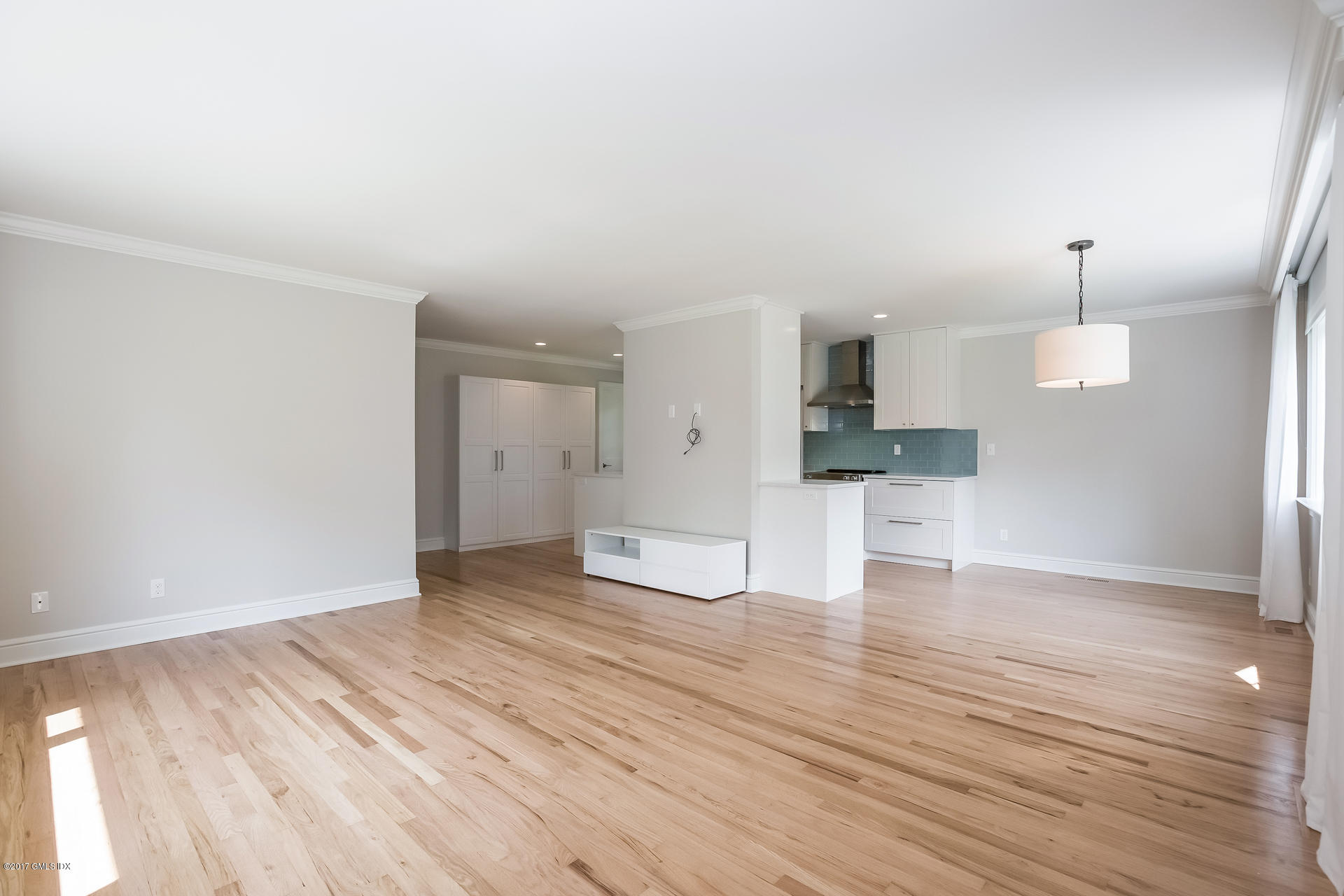 395 Taconic Road Greenwich, CT 06831 - Photo 10 of 36 a view of a kitchen with a sink and wooden floor