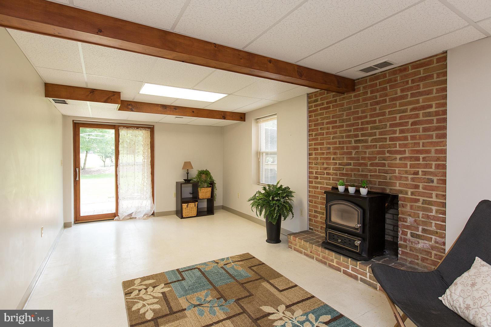 37 Greythorne Road Lancaster, PA 17603 - Photo 34 of 48 Finished basement includes coal stove.