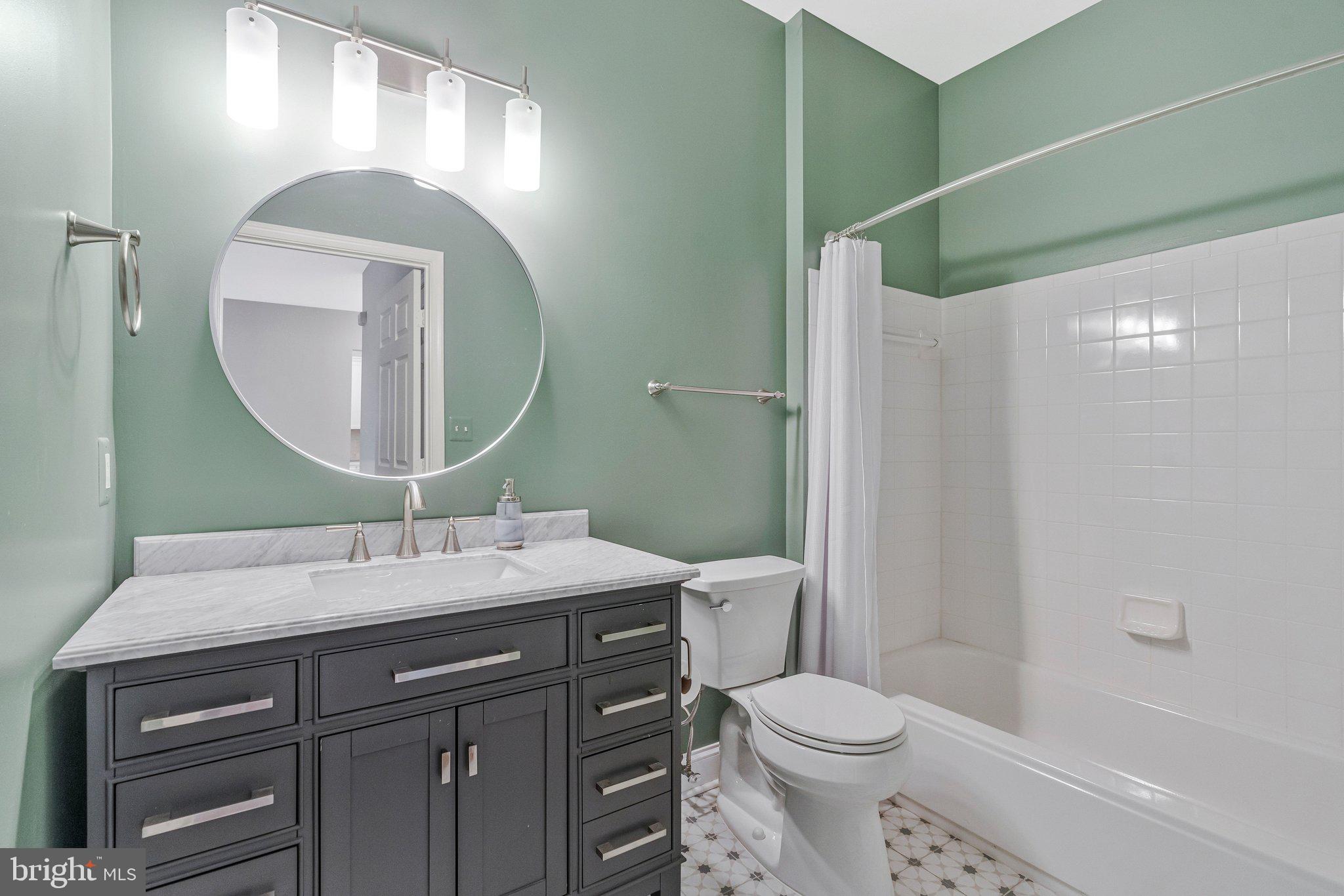 11405 Windleaf Court, Unit 23 Reston, VA 20194 - Photo 15 of 24 a bathroom with a sink and a mirror