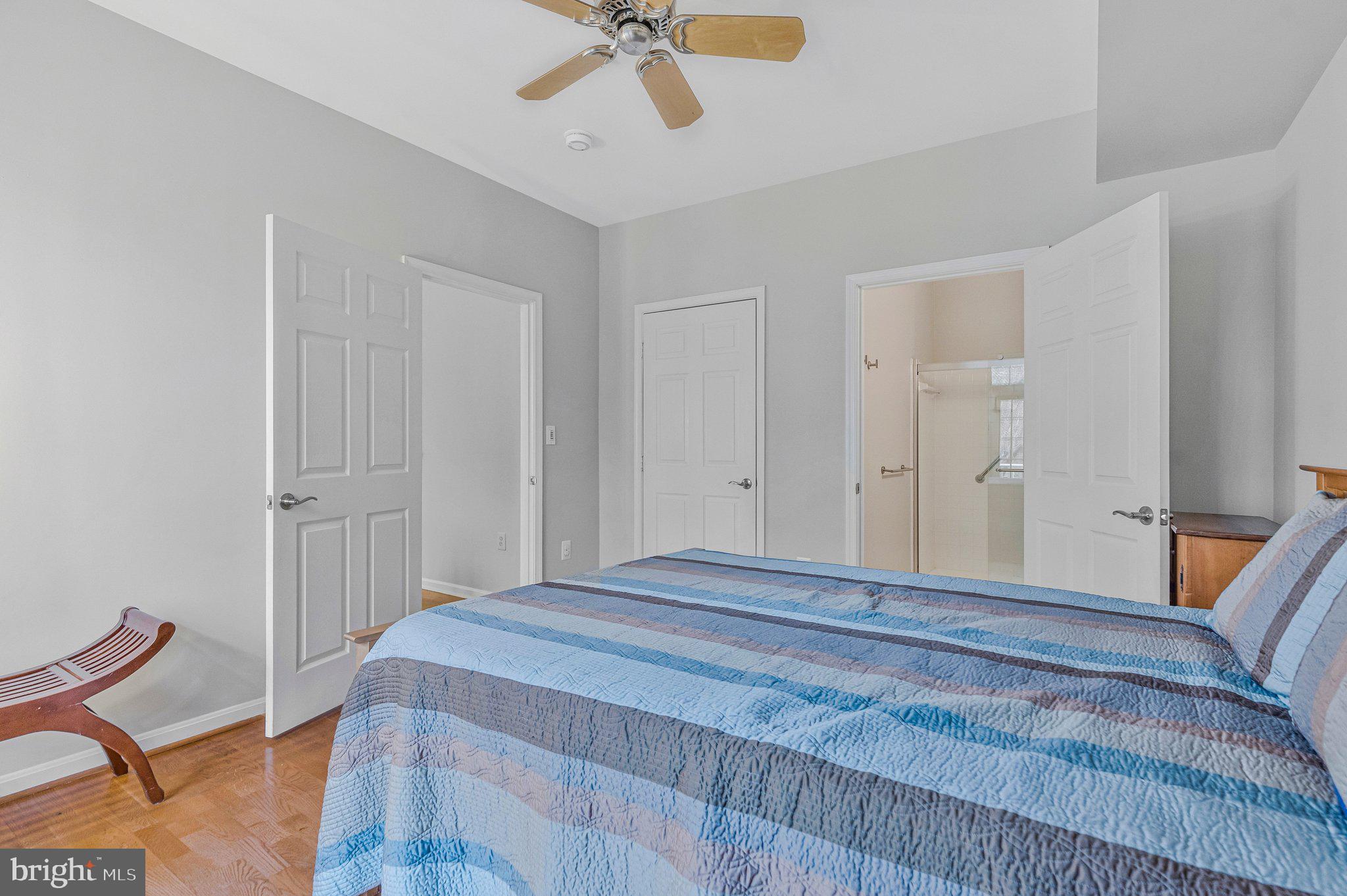 11405 Windleaf Court, Unit 23 Reston, VA 20194 - Photo 17 of 24 a bedroom with a bed and cabinets