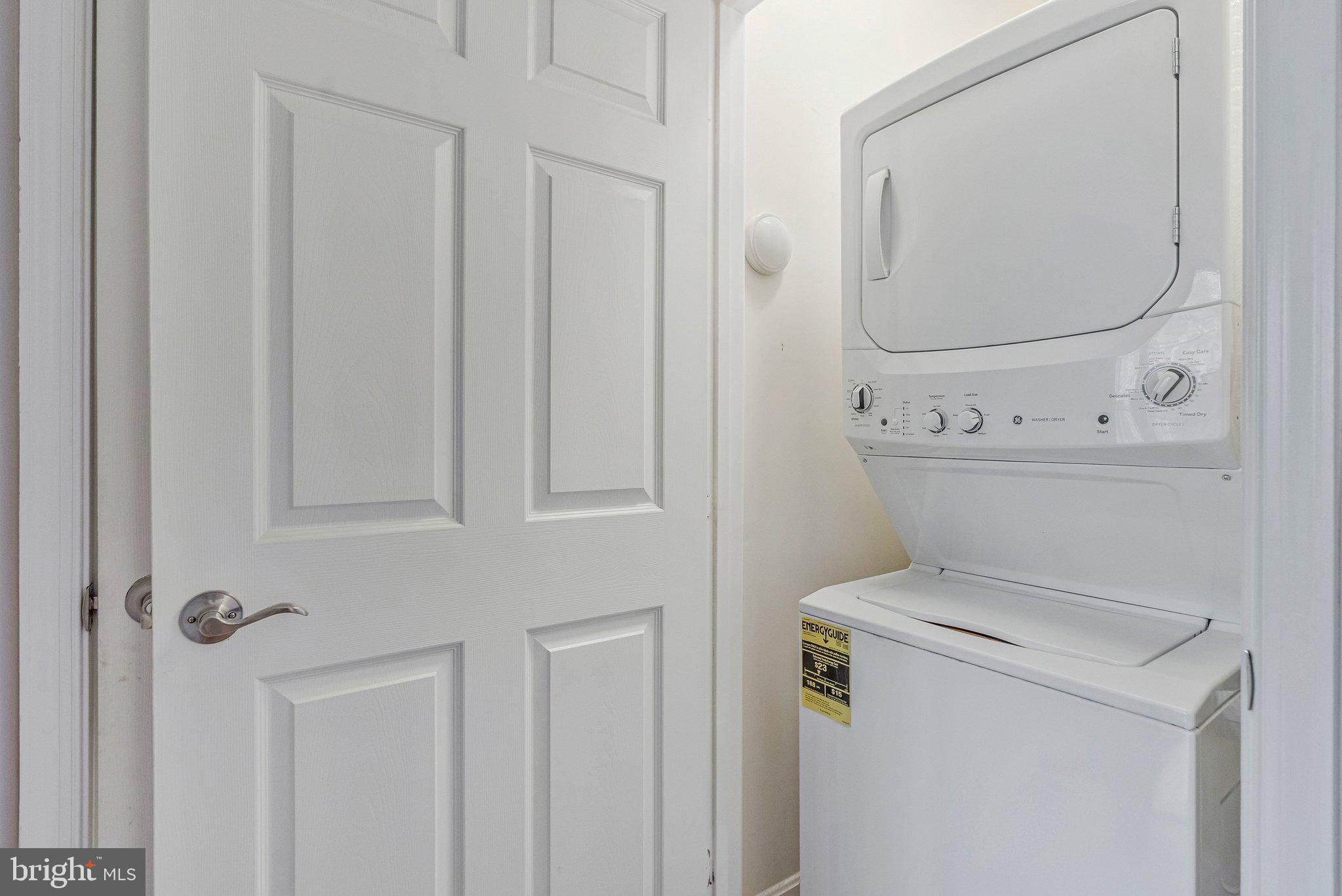11405 Windleaf Court, Unit 23 Reston, VA 20194 - Photo 19 of 24 a utility room with dryer and washer