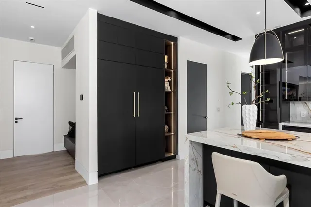 a bedroom with a bed and large window