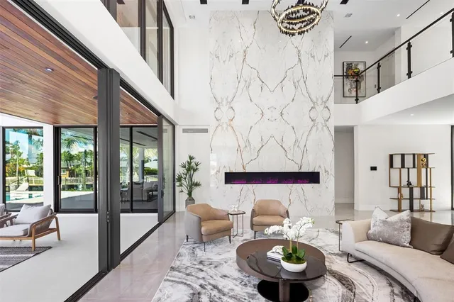 a white toilet sitting next to a bathroom and a sink