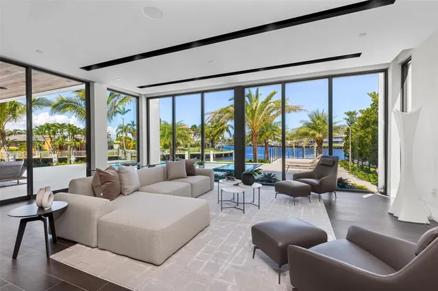 a living room with a table and chairs