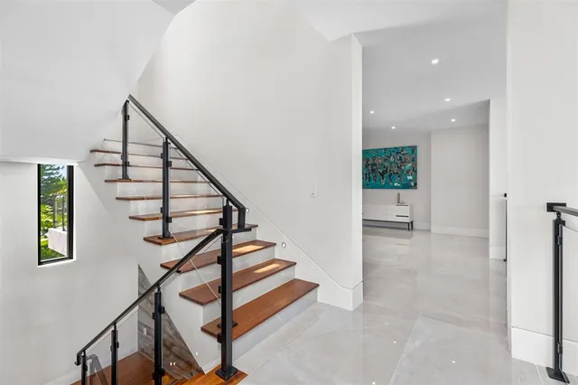 a view of swimming pool with outdoor seating and plants